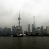 Impressive At Daytime...  Shanghai's Skyline, the "Pudong New Area" - the large building on the right is just about to be finished: Shanghai Tower, 632m high, is currently the second talles building on the planet...