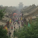 Pingyao  Pingyao is in Shanxi province, which is heavily polluted. This day was supposed to be a sunny day, but it looked foggy anyway, because the air was full of coal dust. By then I was already accustomed to the permanent air pollution, but was suprised that virtually nobody was wearing face masks for protection.