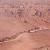 Gobi Desert  It looks like a Mars scene in "Total Recall", but it's actually just some trucks crossing a sandy road in the Gobi desert...