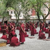 Monk Debating at Sera Monastery  Every afternoon at Sera Monastery in Lhasa, monks are debating. The higher, more experienced monks are challenging the younger ones with spiritual, moral or philosophical questions. Their answer is being confirmed with a loud clap of the hands, some theatrical gestures and possibly a debate over the correctness of the answer, so this becomes a very lively and noisy event.