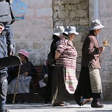 Heavenly Pilgrims - Heavily Guarded  Pilgrims doing the Kora, while being closely guarded by chinese policemen. A very typical scene - all the sacred places in Titbet, which attract masses of pilgrims, are heavily guarded - ostensibly to protect the wholy places from terrorist attacks, but of course it is in the first place to prevent from groups of tibetans gathering and organising protest.