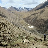 The Next Valley  Behind the first pass, a remote and beautiful valley was unfolding. After heavy negotiation with the Yak Man whe were able to convince him to walk down into this valley and camp for another night. This was the final compromise, though. Next day (day three) he would walk back to his village with the money for six days of trekking in his pocket :-(