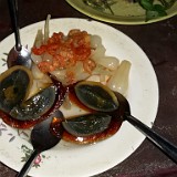 Food Experiments III  We sticked to the eggs - this one being a plain chicken egg, but preserved in a mixture of clay, ash, salt and other condiments - the so called "hundred year egg" (eventhough probably not older than a few weeks). It looks quite groce, and - honestly - it was not very tasty either.