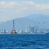 Nha Trang  View of Nha Trang from the ocean - the cable car leads tourists over to the Vinpearl theme park and has become quite a landmark of the city.