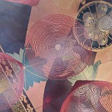 Incence Spirals in Ceiling  All temples are full of incense sticks and - more picturesque - incense spirals. These are hung from the celings together with wishes and prayers which, toghether with the somoke, are sent to the land of the gods...